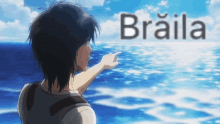 a man is pointing at the ocean and the word braila is on the bottom right