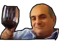 a man is holding a glass of red wine and smiling