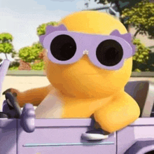 a cartoon character wearing sunglasses is sitting in a car .