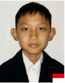 a young boy is wearing a black jacket and a white shirt .