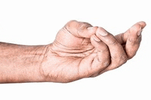 a close up of an elderly man 's hand holding something .