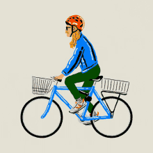 a woman wearing a red helmet is riding a blue bike