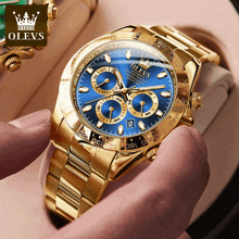 a gold olevs watch with a blue face and gold band