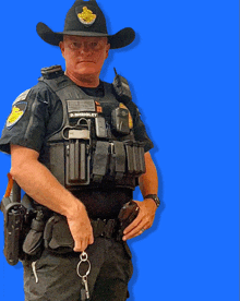 a police officer wearing a cowboy hat has the name d. sheroley on his chest