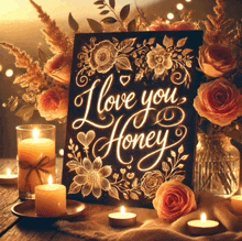 a sign that says " i love you honey " is surrounded by candles and flowers