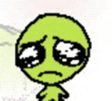 a pixel art drawing of a green alien with sad eyes .