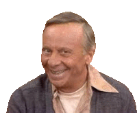 a man wearing a sweater and a shirt is smiling .