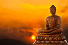 a statue of a buddha sitting in a lotus position