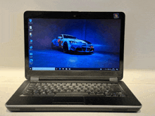 a laptop with a picture of a car on its screen