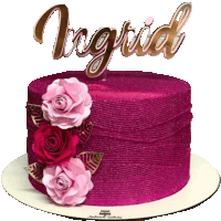 a pink cake with the name ingrid on top of it