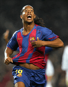 a soccer player wearing a shirt that says fcb on it