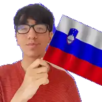 a man wearing glasses is holding a russian flag in front of his face