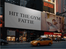 a billboard that says hit the gym fattie