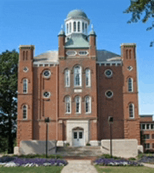 a large brick building with a dome on top of it