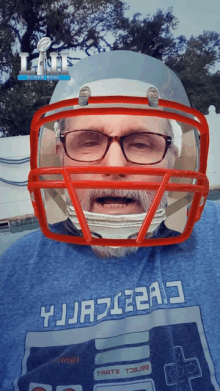 a man wearing glasses and a football helmet is wearing a shirt that says yjjazz2a3 on it