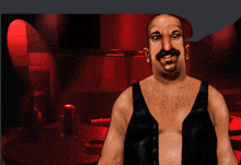 a bald man with a mustache wearing a black tank top