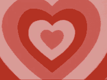 a bunch of red hearts are stacked on top of each other on a pink background .