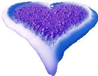 a blue and white heart shaped object with purple powder on it