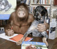 a monkey and a dog are sitting at a table in front of a book called barry 's & rescue