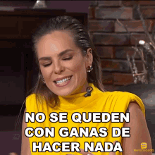 a woman wearing a yellow top is smiling and says no se queden con ganas de hacer nada