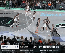 a basketball game between liberty and fever is being played at the barclay center