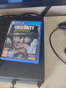 a copy of call of duty wwii is sitting on a ps4