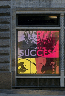 a sign in a window says fight for success