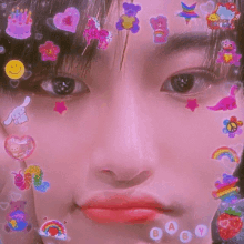 a close up of a person 's face with stickers on it including hello kitty