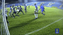 a group of soccer players are playing on a field with a sign that says copa do nordeste on it