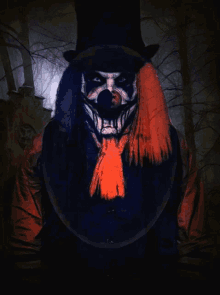 a scary clown with a top hat and scarf on