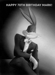 a black and white photo of bugs bunny in a tuxedo and bow tie