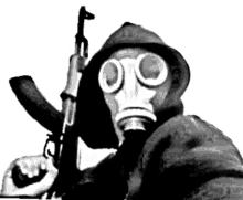 a man wearing a gas mask holding a gun