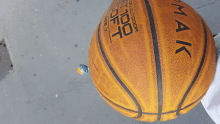 a basketball that says 100 % outdoor on it