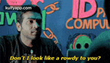 a man says " do n't i look like a rowdy to you " while looking at a computer screen