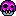 a pixel art drawing of a purple skull with sharp teeth and a black background .