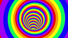 a rainbow colored optical illusion of a tunnel