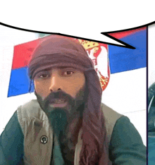 a man with a beard wearing a head scarf and a speech bubble