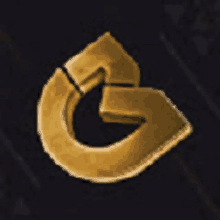 a gold letter g is on a black surface