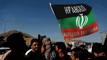 a group of people holding up a flag that says iran on it