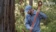 a man wearing a hat and overalls is holding a large orange stick in front of a sign that says dr. squatch