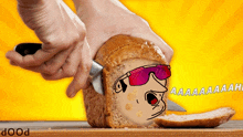 a person is cutting a loaf of bread with a cartoon character on it