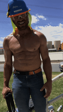 a shirtless man wearing a hard hat that says skyline on it