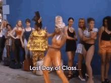 a group of women standing in front of a blue wall with the words last day of class on the bottom