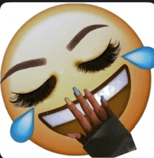 a laughing emoji with tears coming out of its eyes