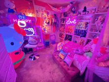 a room with a neon sign that says be happy and love