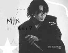 a black and white photo of a man with the words min in milan on the bottom