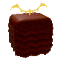 a close up of a brown cube with a bat on top of it .