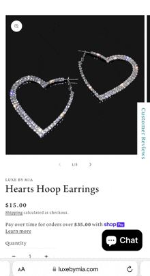 a pair of heart shaped hoop earrings are on a website