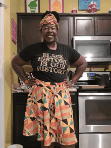 a woman wearing a black t-shirt that says black history is our history