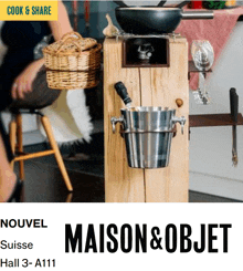 a flyer for maison & objet shows a wooden block with a bucket on it